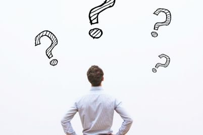 7141-back-view-of-man-looking-at-wall-of-question.jpg
