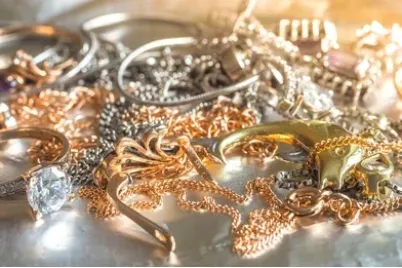 silver-gold-jewelry-piled-on-260nw-1014117826-e1793345425649.webp